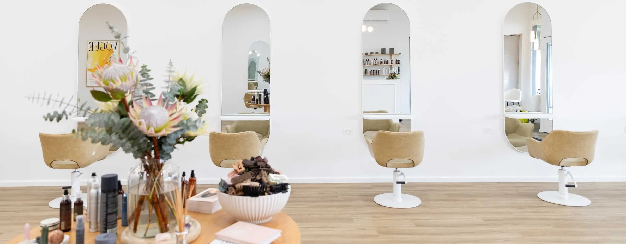 Styling stations and arched mirrors inside Ergo and Mane organic hair salon, six minutes from Inglewood, Victoria
