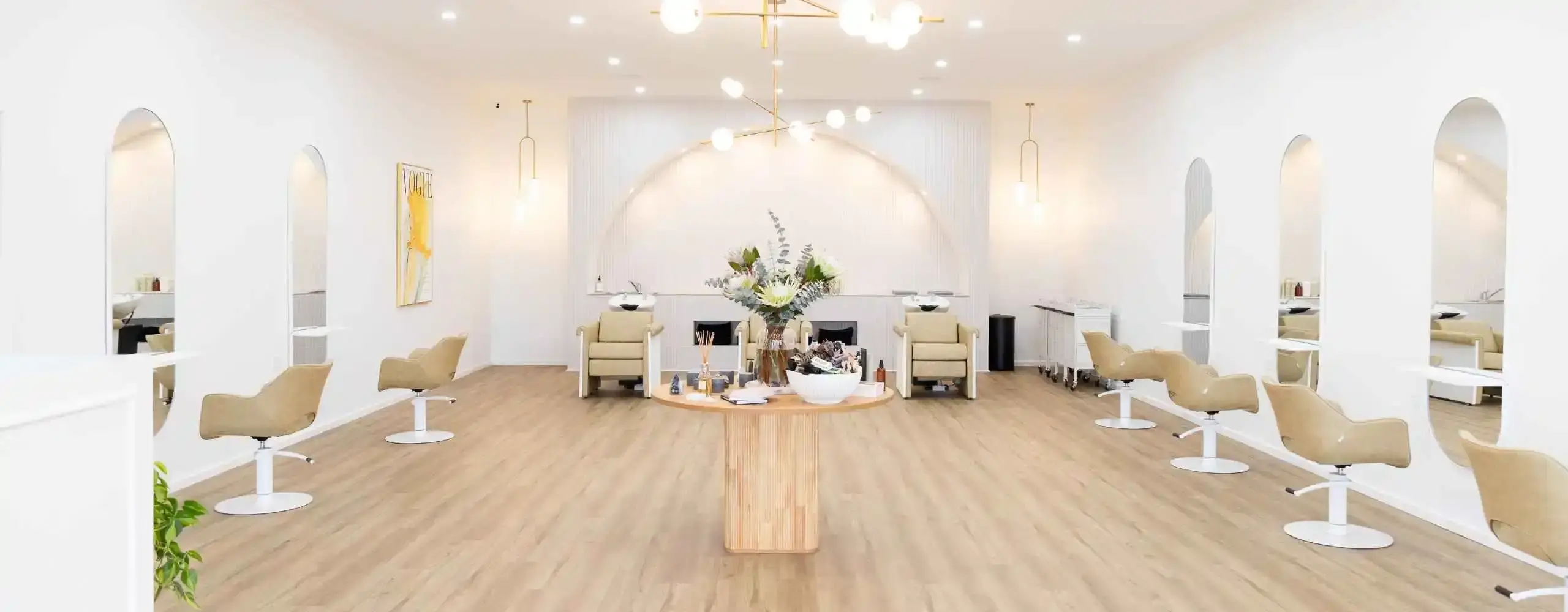 Interior of Ergo and Mane organic hair salon in Bridgewater on Loddon, near Bendigo, with arched mirrors and styling chairs