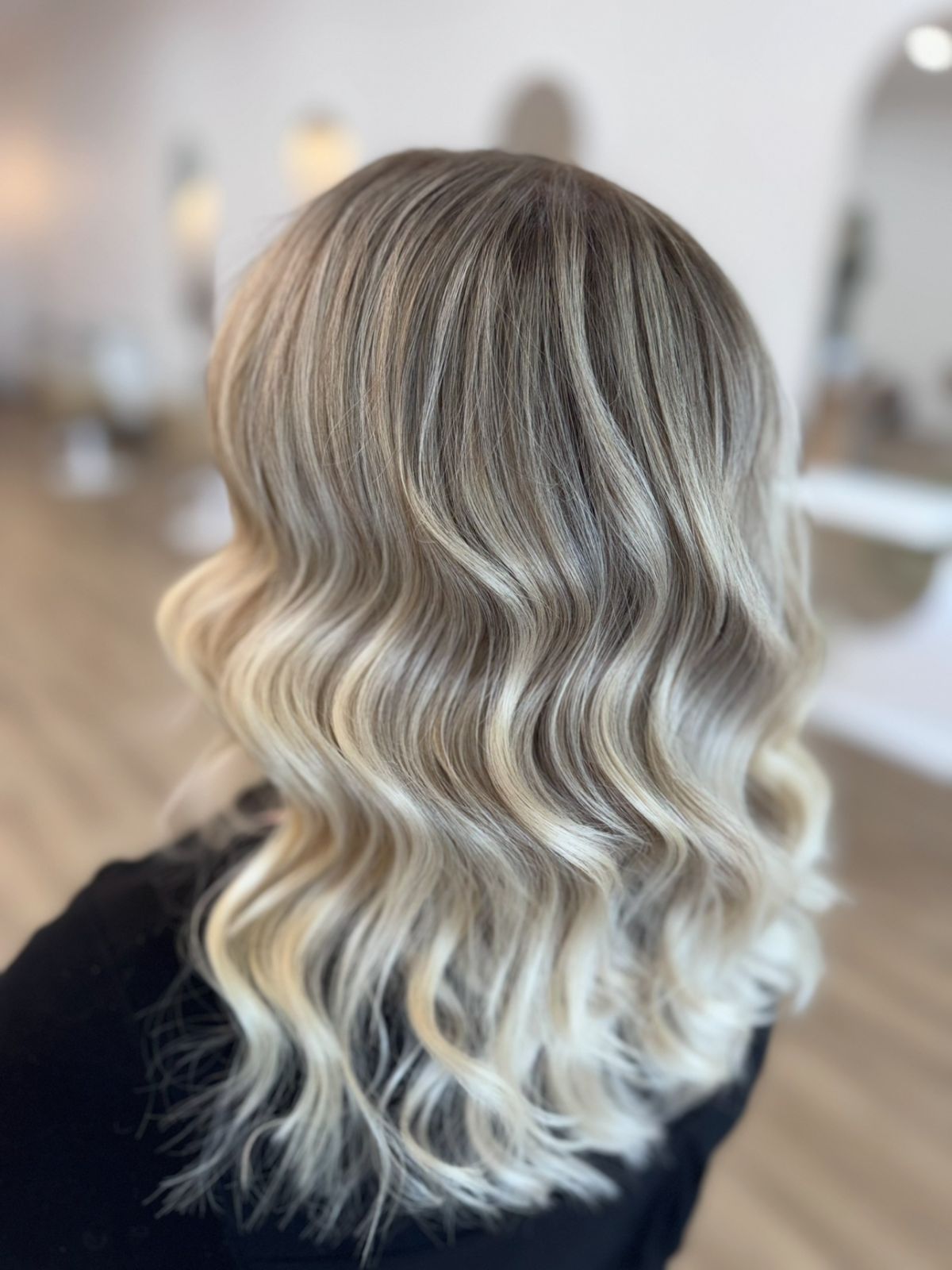 Lived-in blonde balayage with glossy waves at Ergo and Mane Bridgewater near Bendigo