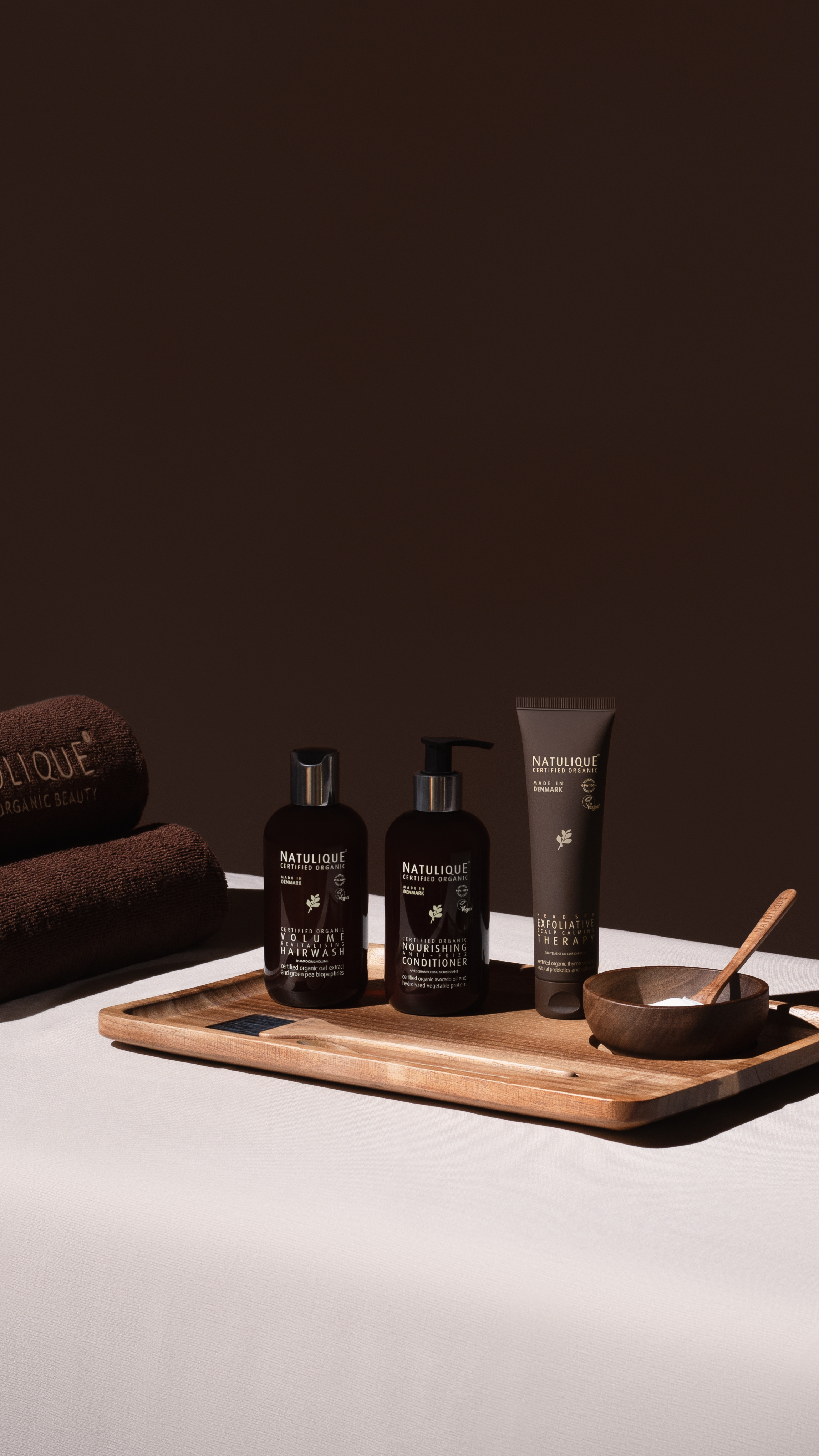 NATULIQUE certified organic head spa products including volume hair wash nourishing conditioner and exfoliative therapy at Ergo and Mane Bridgewater